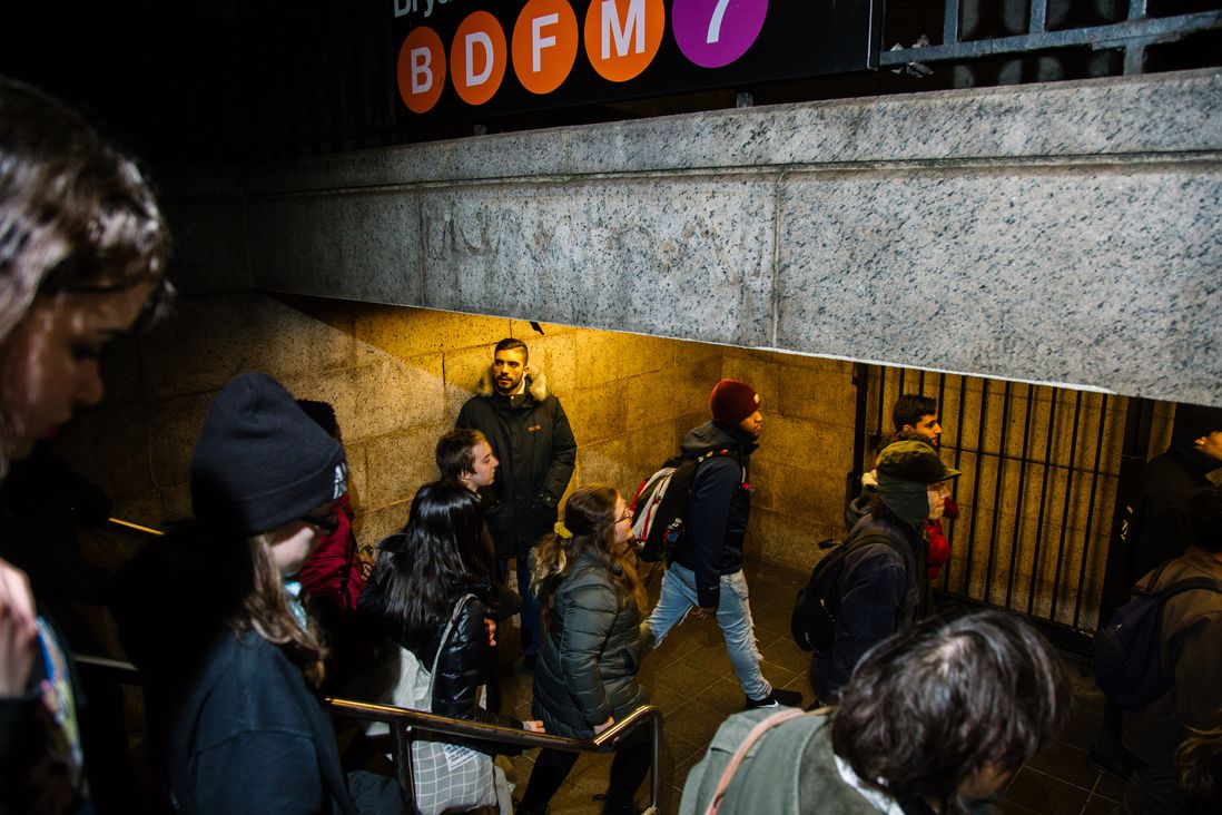 Protesters enter the subway on Friday night.